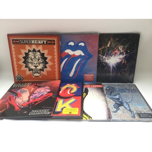 409 - Two bags containing seven Rolling Stones and related LPs comprising 'Hackney Diamonds', 'Blue & Lone... 