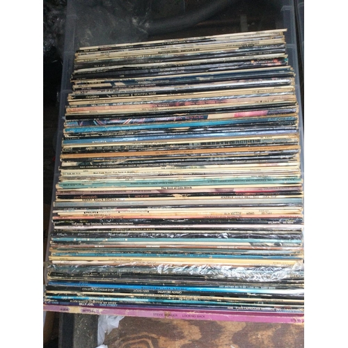 75 - A box of LPs by various artists including Neil Young, CSNY, Bruce Springsteen and others.