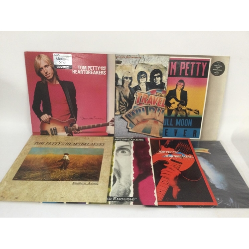 816 - Seven Tom Petty and related LPs including a remastered 'Damn The Torpedoes'.