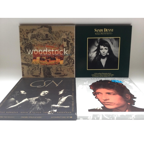 85 - Four CD box sets comprising Bob Dylan, Sandy Denny, Crosby, Stills and Nash and Woodstock.