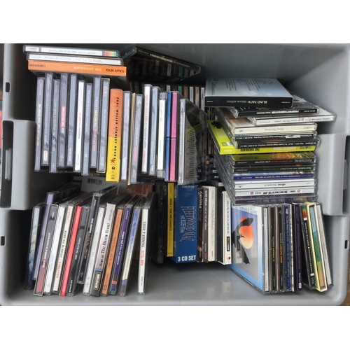 87 - Four boxes of CDs and DVDs by various artists including Paul Weller, Genesis, Black Sabbath, Fairpor... 