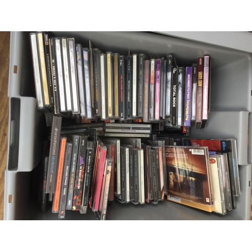 87 - Four boxes of CDs and DVDs by various artists including Paul Weller, Genesis, Black Sabbath, Fairpor... 