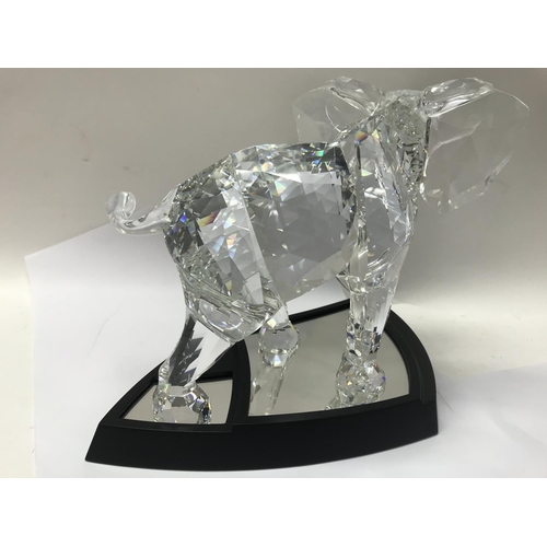 1047 - A cased Swarovski limited edition Elephant with stand. 01962/10000, together with Certificate of Aut... 