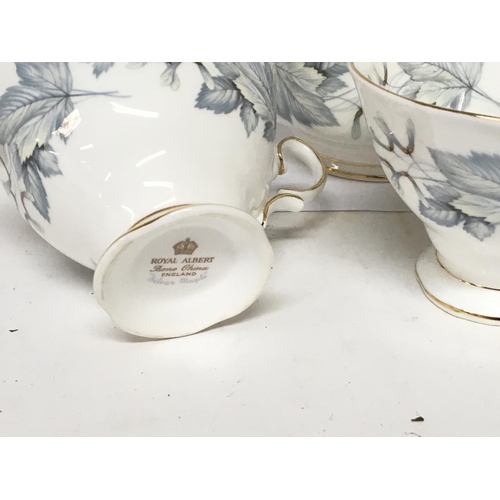 1141 - A Royal Albert English Porcelain Bone China part tea set Silver Maple pattern four cups cream jug pl... 