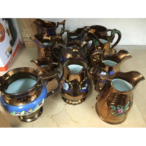 1145 - A collection of Victorian and later copper lustre jugs.