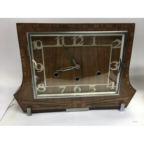 1206 - A 1930s art deco walnut inlaid mantle clock. Approx 33cmx24cm.