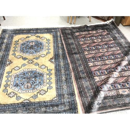 1216 - Two large 20th century hand tied wool rugs one with an unusual horizontal repeating pattern. Both pr... 