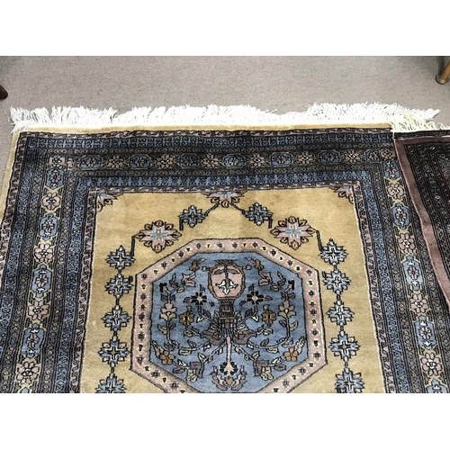 1216 - Two large 20th century hand tied wool rugs one with an unusual horizontal repeating pattern. Both pr... 