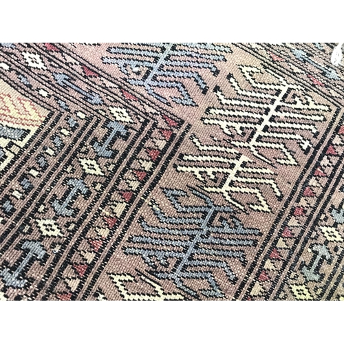 1216 - Two large 20th century hand tied wool rugs one with an unusual horizontal repeating pattern. Both pr... 