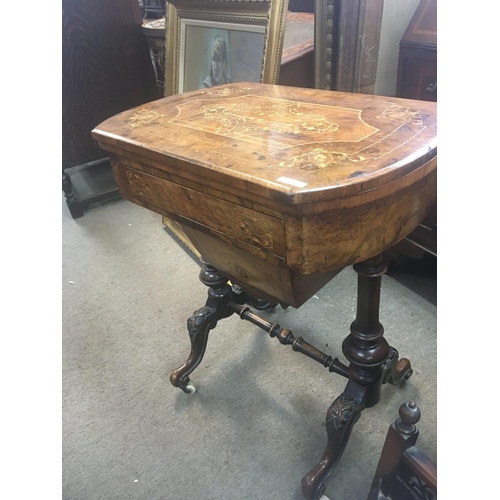 1247 - A Victorian inlaid walnut games workbox the hinged top with games board above a single drawer on tur... 