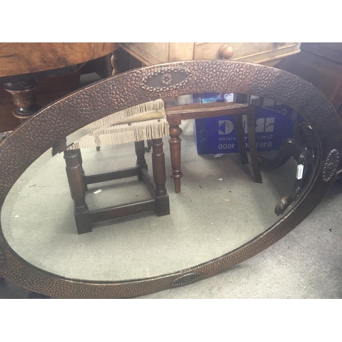 1251 - An oval copper framed mirror with a bevel edge. An oak framed mirror an oak stool and Victorian chai... 