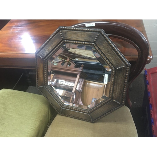 1251 - An oval copper framed mirror with a bevel edge. An oak framed mirror an oak stool and Victorian chai... 