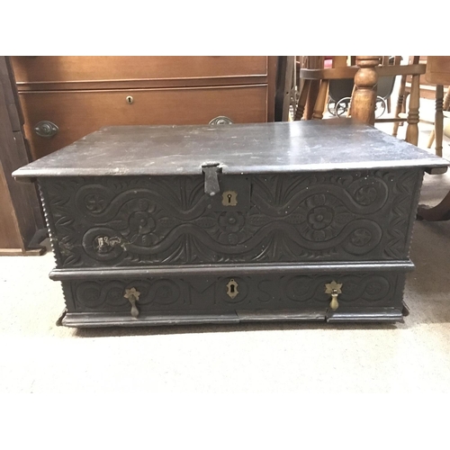 1255 - A 19th century design oak chest with carved design front and side panels. Dimensions 50x72x34cm