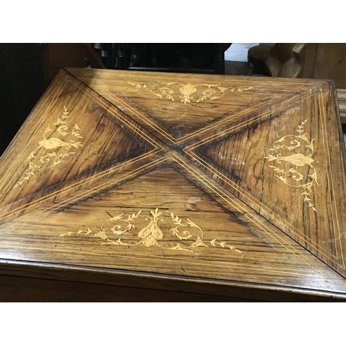 1268 - An Edwardian rosewood envelope card table with inlaid design dimensions 53x53x70cm.