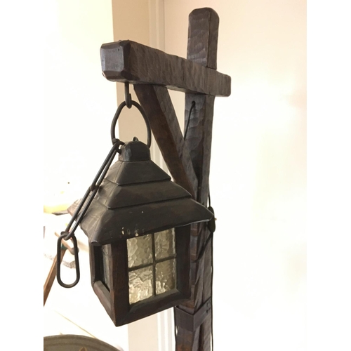 1276 - An Arts & Crafts style Lamp with lantern. 74cm tall