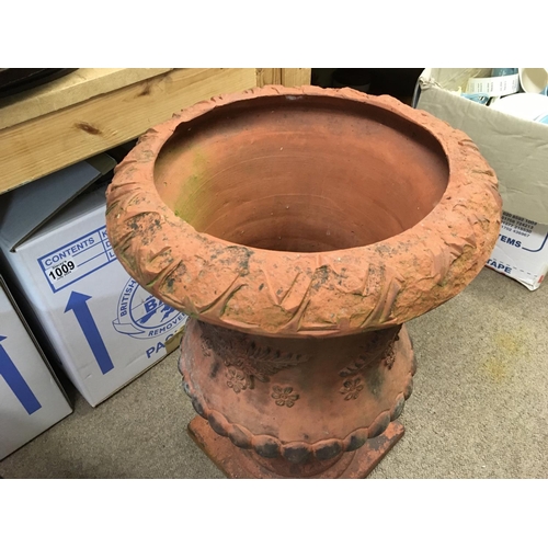 1283 - A Large Victorian terracotta urn. 50cm tall and 35cm wide.