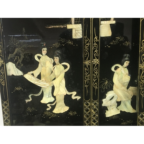 1285 - A set of four mid 20th century Oriental lacquered panels decorated with raised painted mother of pea... 