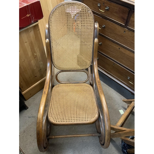 1318 - A 19thC bentwood cane rocking chair. (D)