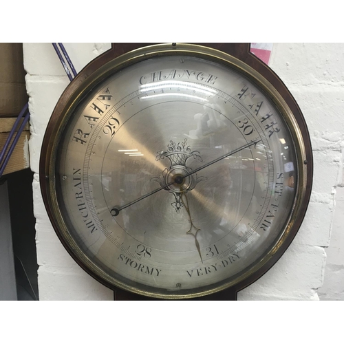 1331 - A Georgian mahogany barometer inset with thermometer box and an enamel dial clock