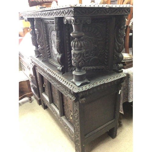 1332 - A 17th Century carved oak Court Cupboard the top section with carved pillars and a single cupboard a... 