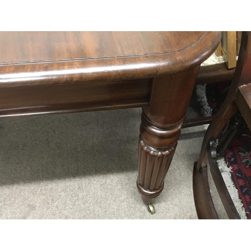 1360 - A Victorian mahogany dining table with matching chairs