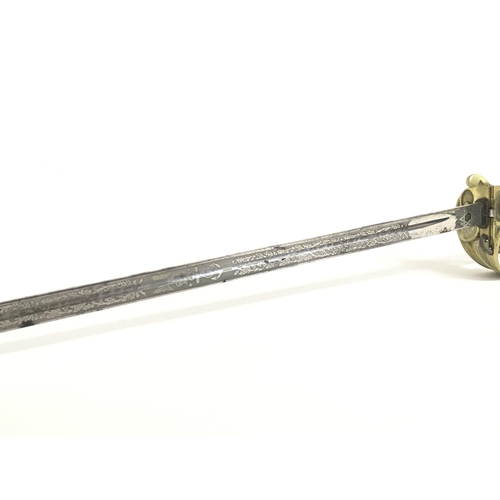 1579 - A 19th Century British Naval officers sword with leather scabbard. 32 Inch ornately decorated blade ... 