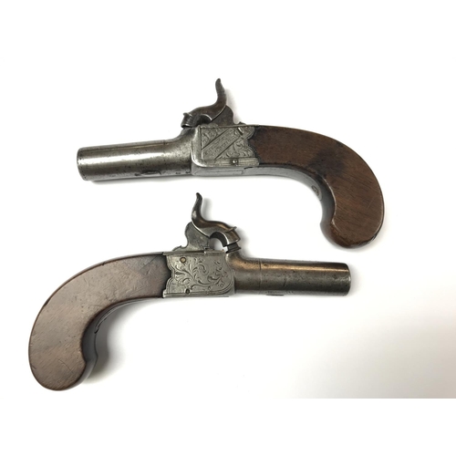 1589 - A pair of English percussion cap pistols with walnut grips. Marked Fenton London. Also two powder fl... 