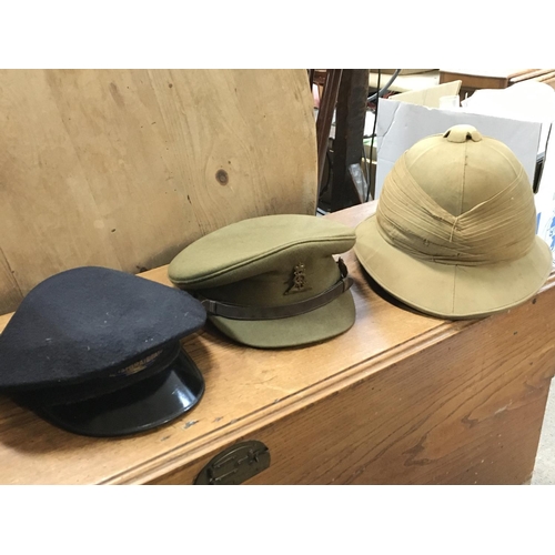 1607 - A collection of military uniforms including hats, combat trousers, bags etc. This lot cannot be post... 