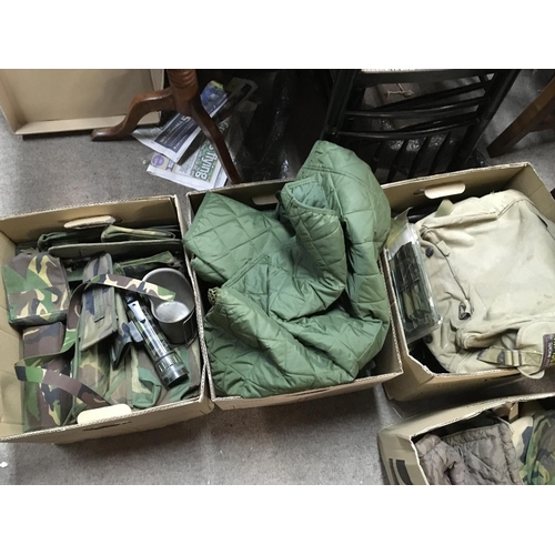 1607 - A collection of military uniforms including hats, combat trousers, bags etc. This lot cannot be post... 