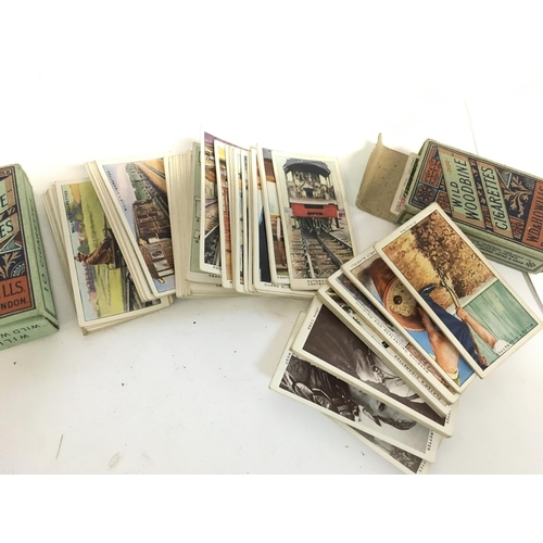 1668 - A collection of Players and Wills cigarette cards in sets and packets. Postage category C