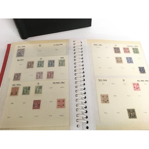 1697 - Two stamp albums including an album consisting of 20th century Chinese stamps and an album of world ... 