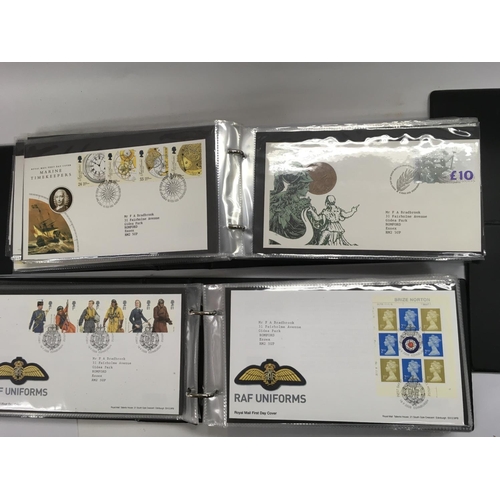 1764 - A large collection of assorted first day covers including Wallace and gromit Alice in Wonderland etc... 