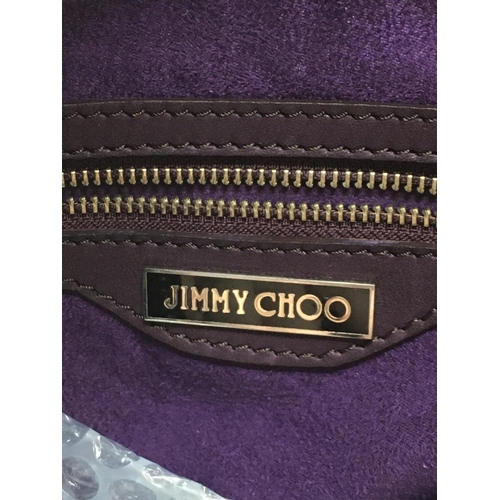 1861 - A Jimmy Choo Purple leather hand bag, postage category C