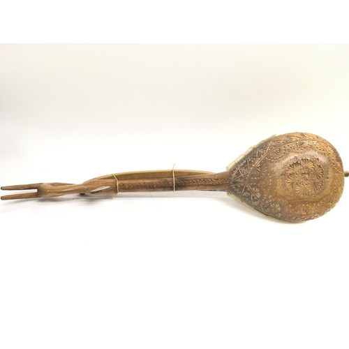 1879 - A wooden Gusle with a carved design body and skin drum cover ,approximately 60Cm long. postage categ... 