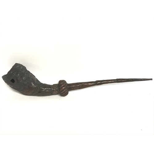 1903 - A 19th century copper opium pipe, 42cm long. Postage category C