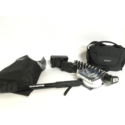 A Sony Cyber Shot DSC-HX50v camera with various camera accessories