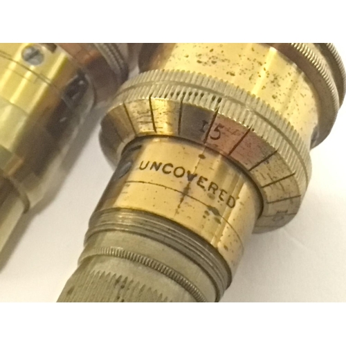 710 - Two cased brass 1/2 inch microscope lenses by J.B Dancer and Ross. This lot cannot be posted