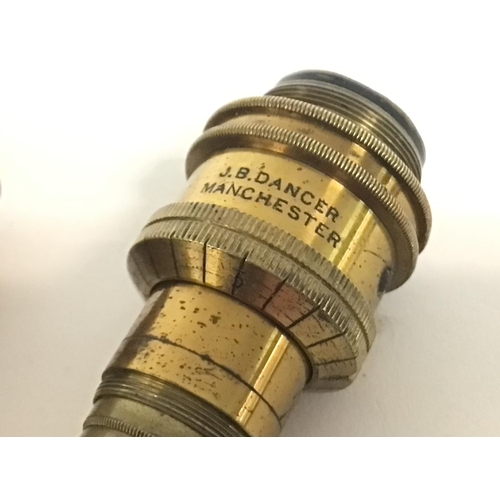 710 - Two cased brass 1/2 inch microscope lenses by J.B Dancer and Ross. This lot cannot be posted