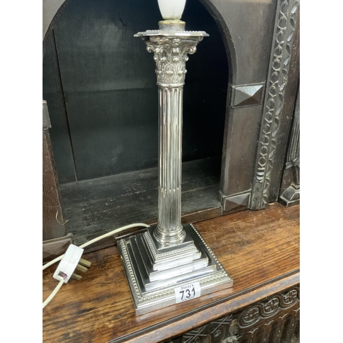 731 - A large Silver plated Corinthian column candlestick, 36cm.