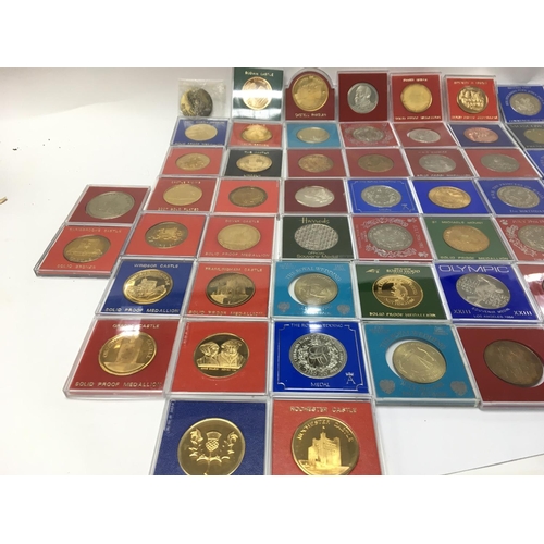 765 - A large collection of assorted commemorative medals including many 22ct gold plated examples. Postag... 