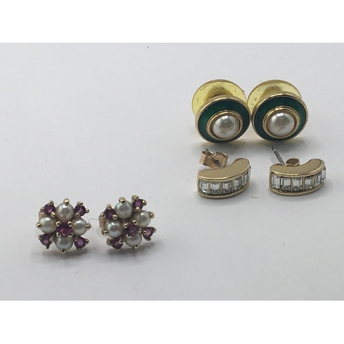 777 - A pair of 9carat gold earrings set with pearl and garnet stones and two other pairs of gold plated d... 