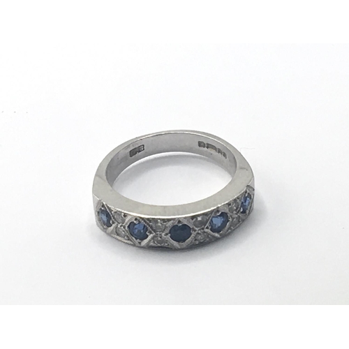 780 - An 18carat white gold ring set with blue sapphire and chip diamonds weight 7g ring size N.