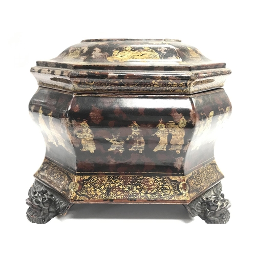 801 - A Chinese black lacquer box with gilt decoration and dragon head feet, dimensions 25x19x16cm approxi... 