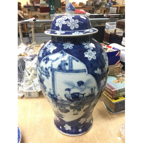 802 - A large blue and white vase and cover decorated with figures, approx height 48cm. Shipping category ... 