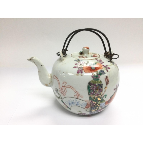 806 - An Oriental teapot with hand painted decoration, approx height 12cm.