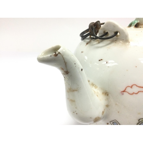 806 - An Oriental teapot with hand painted decoration, approx height 12cm.