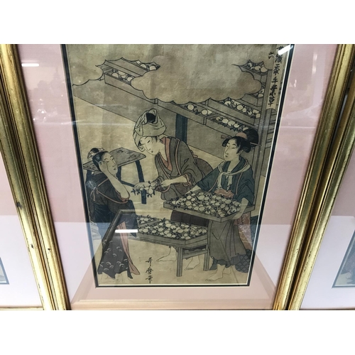 807 - Four framed Utmaro woodblock prints. 39cm wide by 52cm high.