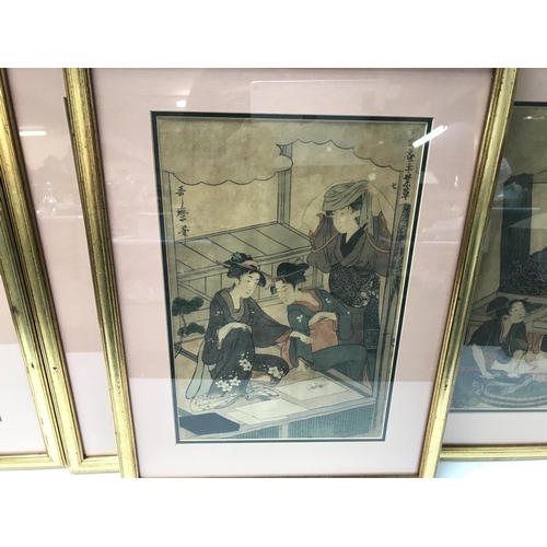 807 - Four framed Utmaro woodblock prints. 39cm wide by 52cm high.