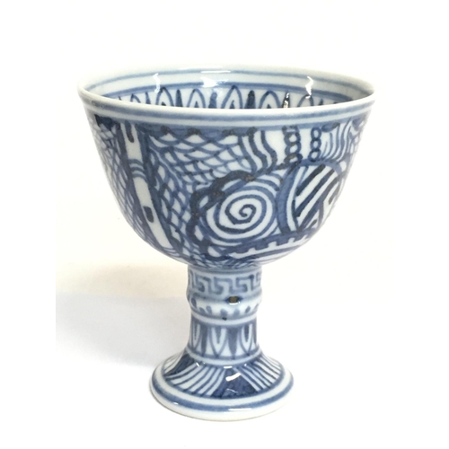 813 - A Chinese blue and white high stand cup , 9cm tall. No obvious damage or restoration. This lot canno... 