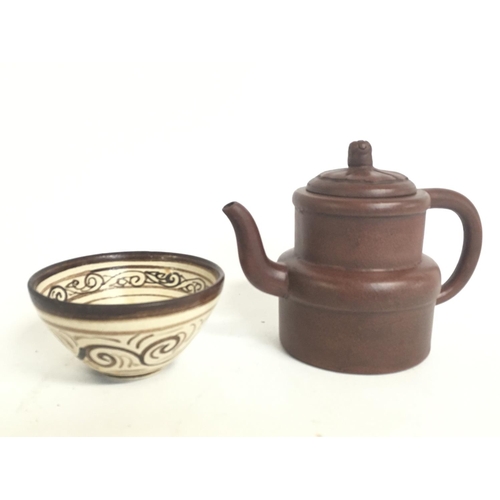 816 - A Chinese Terracotta tea pot and a reproduction bowl. This lot cannot be posted